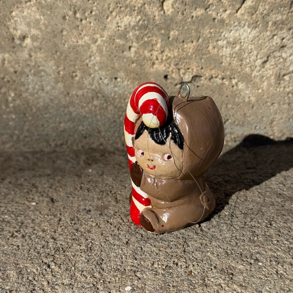 Vintage Eskimo Baby Holding a Candy Cane Holiday Ornament